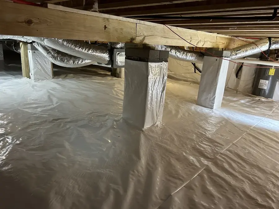 Standing water pumped out of a Cary crawl space
