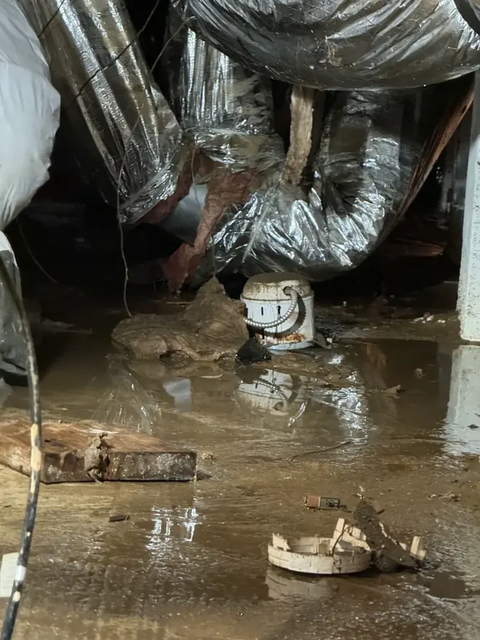 Frozen and split water pipe in a Cary garage wall